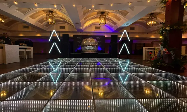 Infinity LED dance floor inside a vaulted ballroom