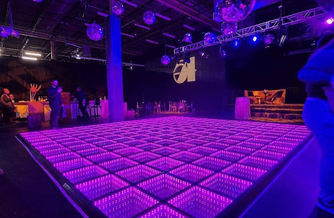 Magenta infinity LED dance floor at a studio nightclub event